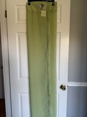 Pair of Grommett Top Green Sheer Curtains